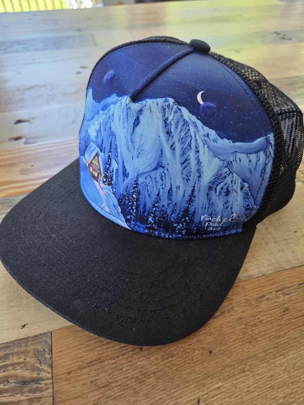 Sunday Afternoons Artist Series Rachel Pohl Winter Cabin Trucker Hat